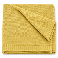 Strickdecke in Senfgelb, gefaltet, Produktansicht [swatch:Senfgelb]